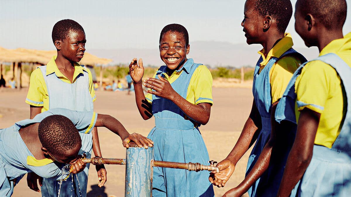 Beast Philanthropy volunteers delivering clean water to a community